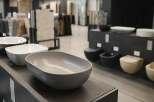 samples of modern sanitary ware for the toilet. new modern toilet in the plumbing store photo