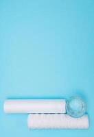 Water filters. Carbon cartridges and a glass with water on a blue background. Household filtration system photo