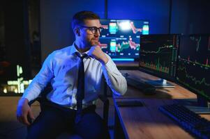 Crypto trader investor analyst looking at computer screen analyzing financial photo