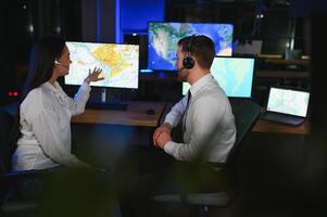 Diverse call center operators team use computers consulting clients in office photo