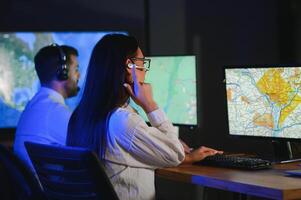 Diverse call center operators team use computers consulting clients in office photo