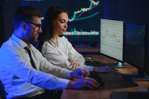 Business team investment working with computer, planning and analyzing graph stock market trading with stock chart data photo