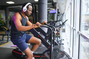 healthy men on gym bike photo