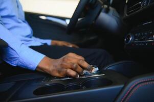 A man's hand on a Gear shift close up photo