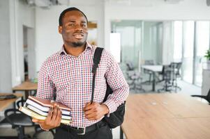 Male student sitting in university classroom. Man sitting in lecture in high school classroom. photo