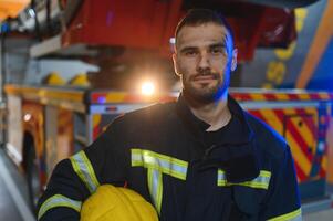 Firefighter rests after fighting a house fire photo