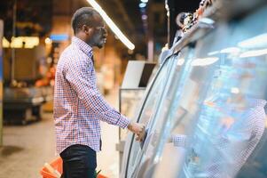 African american Man shopping in a supermarket photo