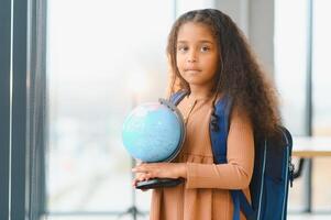 portrait of african american schoolgirl at school photo