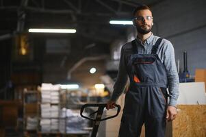 Man working in printing house with paper and paints photo