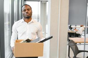 Portrait of african american employee being fired. photo