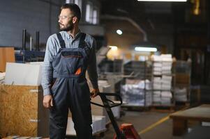 Man working in printing house with paper and paints photo