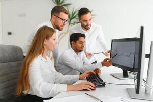 Business team working on their business project together at office. photo