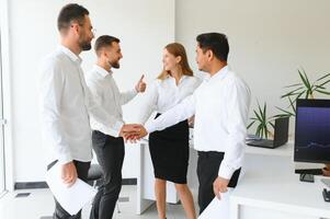 Business team working on their business project together at office. photo