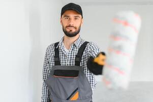 Portrait of a builder in the process of working on a construction site indoors photo