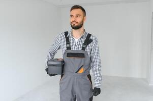 Handsome worker in empty room. photo