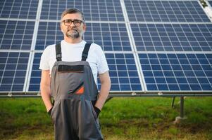 Portrait of a handyman who just installed solar panels. photo