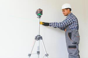 Worker make repairs in new apartment photo