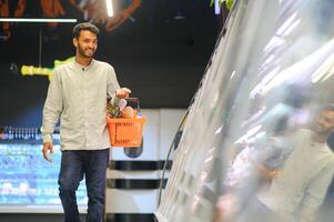 Man at grocery store products photo