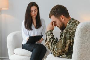 Psychologist supporting military officer in office photo