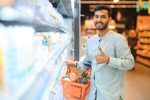 Man at grocery store products photo