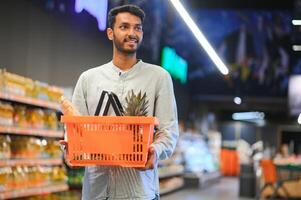 Man at grocery store products photo