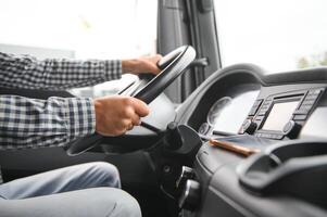 Truck drivers big truck of driver's hands on big truck steering wheel photo