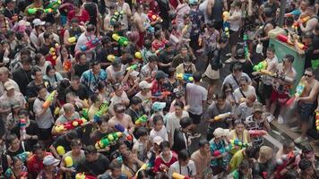 Bangkok, Thailand, April 13, 2024 - Thai New Year or Songkran Festival Thousands of People Gather at Silom Road Water Fight Splash with Water Gun video