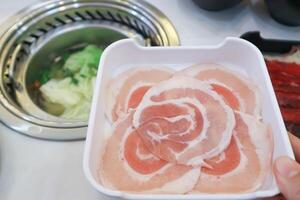 raw pork or sliced pork or meat for cook raw pork or sliced pork or meat for cook or shabu shabu photo