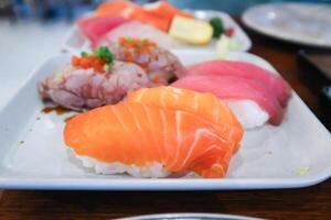 salmon sushi or rice topped with salmon , tuna sushi and beef sushi photo