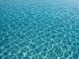 Seamless texture background water. Blue waves sparkle in the sun's rays. Top view photo