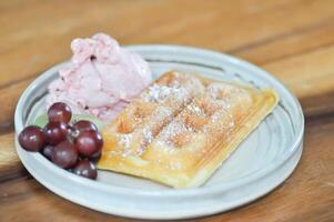 waffle with ice cream and fruit topping photo