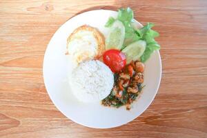 stir fried shrimp or stir fried prawn with holy basil ,rice and fried egg photo