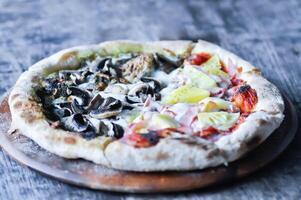 Hawaiian pizza and pesto mushroom pizza ,half and half topping pizza or split half topping pizza photo