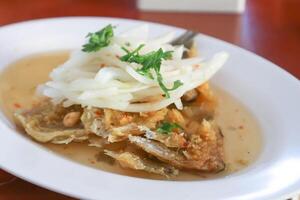 fish salad or fried fish ,deep fried fish or spicy fried fish salad photo