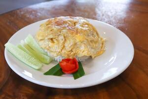 omelette, omelet or deep fried egg and rice photo