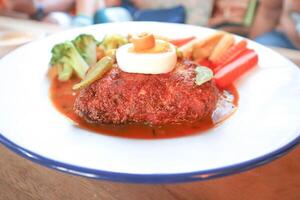 Chicken Cordon Bleu with French fries and vegetable photo