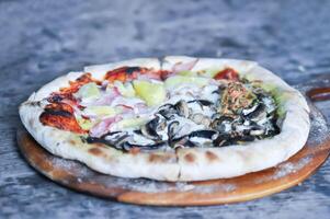 Hawaiian pizza and pesto mushroom pizza ,half and half topping pizza or split half topping pizza photo