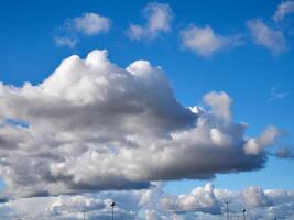 Cumulus clouds in the sky. Fluffy cloud shapes photo