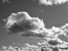 Black and white clouds in the sky background photo