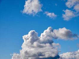 White fluffy clouds in the sky background. Cumulus clouds photo