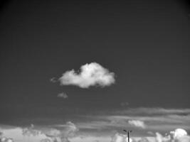 Black and white clouds in the sky background photo