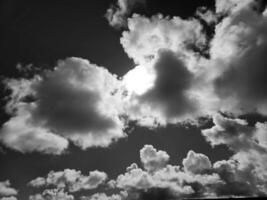 Black and white clouds in the sky background photo