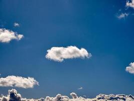 Cumulus clouds in the sky. Fluffy cloud shapes photo