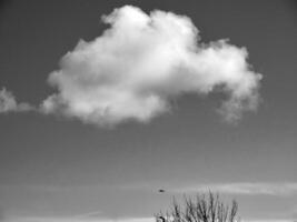 Black and white clouds in the sky background photo