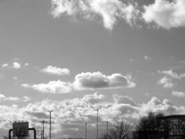 Black and white clouds in the sky background photo