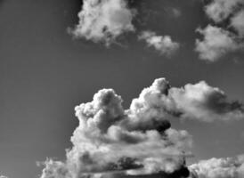 Black and white clouds in the sky background photo