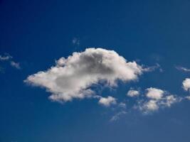 White fluffy clouds in the sky background. Cumulus clouds photo