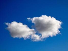 Cumulus clouds in the sky. Fluffy cloud shapes photo