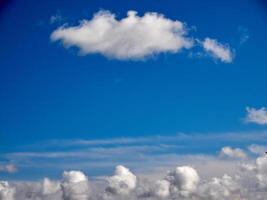 White fluffy clouds in the sky background. Cumulus clouds photo