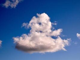 Cumulus clouds in the sky. Fluffy cloud shapes photo